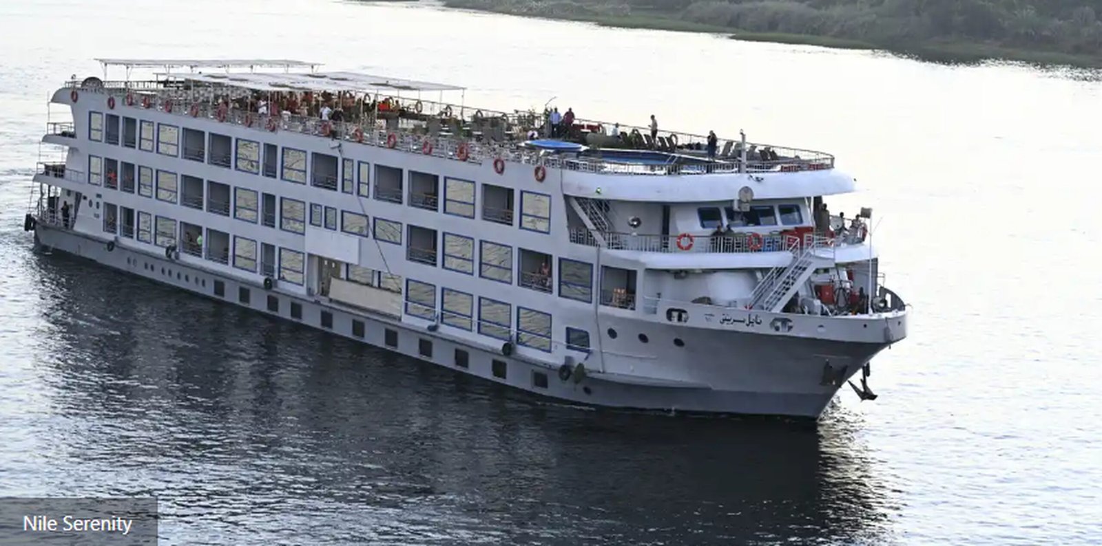 Luxury Nile cruise ship Flash Group MS Serenity sailing on the Nile River with elegant cabins, sun deck, dining area, and panoramic river views.